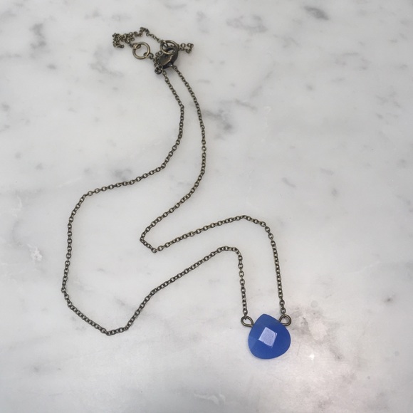 Necklace with a blue pendant