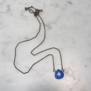 Necklace with a blue pendant