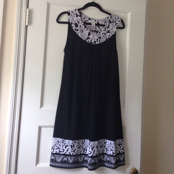 A-line dress. Lovely design at neckline & hem