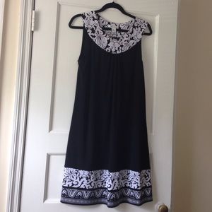 A-line dress. Lovely design at neckline & hem