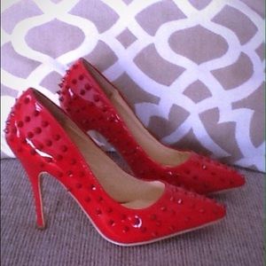 Red spike heels