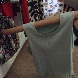 Baby blue tank top with fringe at the bottom
