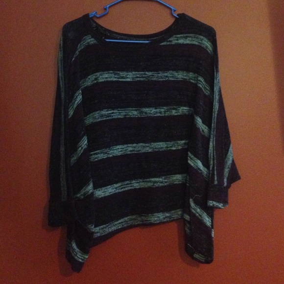 It is a dark purple striped top.