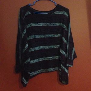 It is a dark purple striped top.