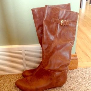 Tall brown leather boots