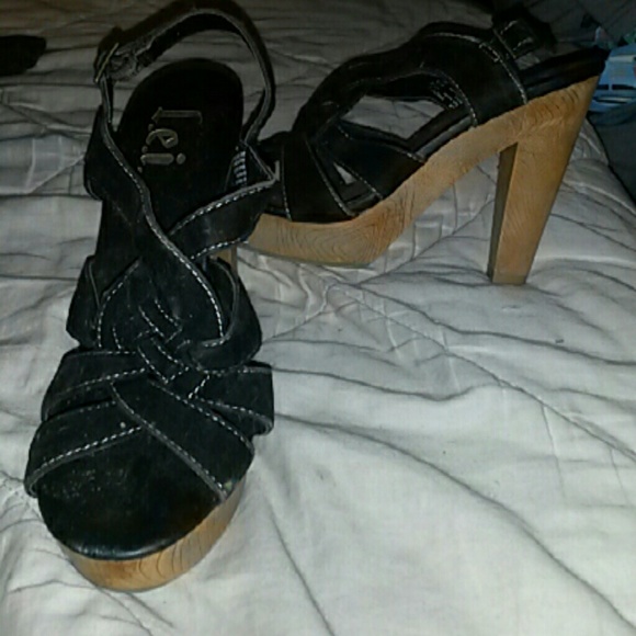 Black heels with wood bottom.