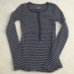 Navy and cream striped long sleeve shirt.