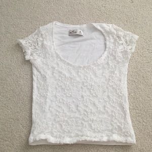 White crop top with white lace overlay.