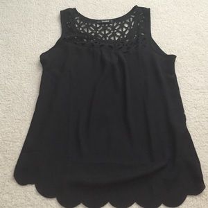 Black chiffon tank top with cut out details.