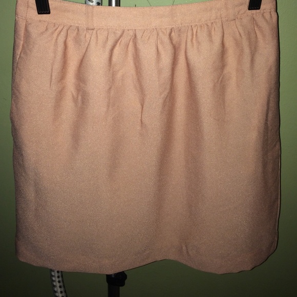 New with tags Peach knee length skirt. Size small