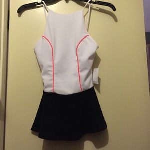 White and Black Peplum Top with Bright Pink Accent