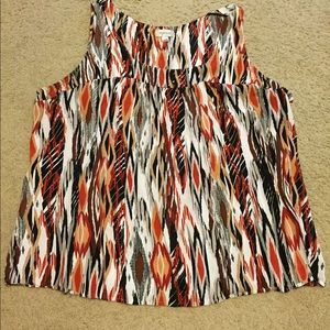 Brown, orange, black, and white sleeveless top.