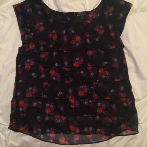 Floral navy blue shirt.