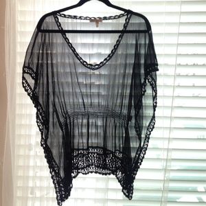 Sheer black top with lace knit detail