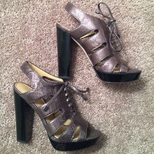 Coach Tie Up Metallic Pumps