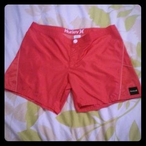 Hot pink Hurley swim shorts.