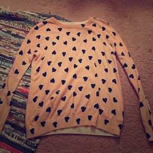 Pink sweater with black hearts