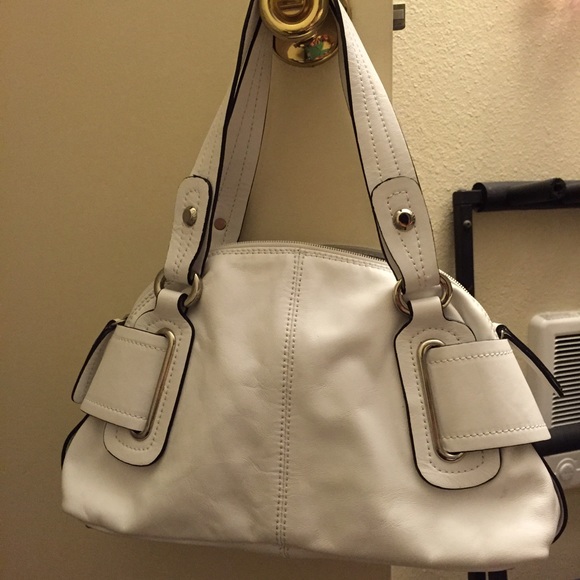 White leather purse.