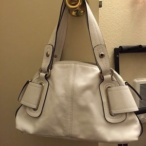 White leather purse.