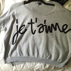 Urban Outfitters Gray cropped graphic sweater.