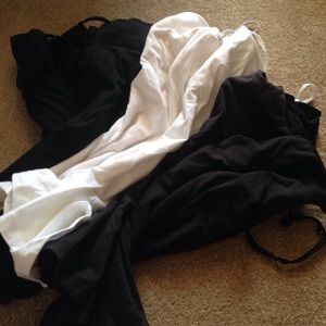 5 Black tank tops and 2 white