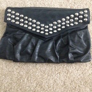 Small studded clutch. Good condition.