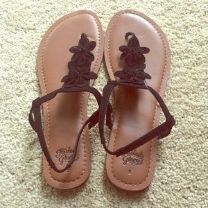 Black flower sandals😆 brown leather. Very cute!