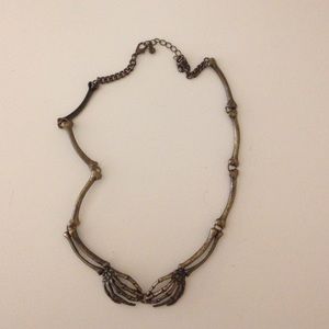 Skeleton hands necklace
