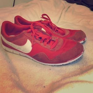 Red nike running shoes