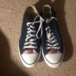 Pink and black converse all star