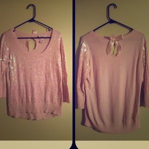 A light pink sweater