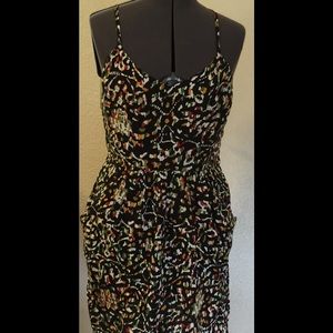 Adorable dress, black background, two pockets