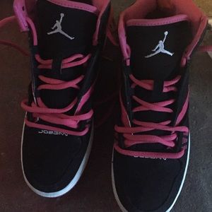 A pink and black Jordan's for girls
