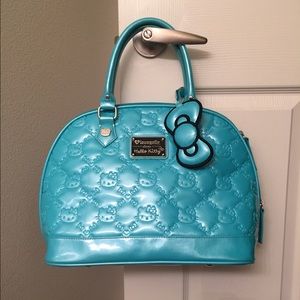 Hello Kitty Embossed Dome Purse. Blue. Large