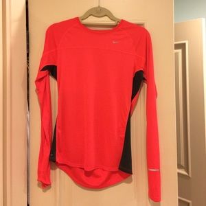 Red-orange Nike shirt