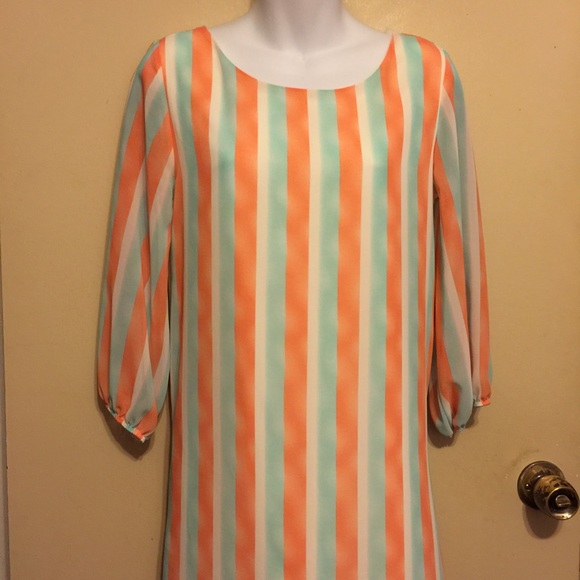 Coveted Dresses & Skirts - A boutique dress with low back with a bow💓