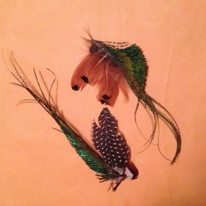 Two quality faux feather hair or style clips.