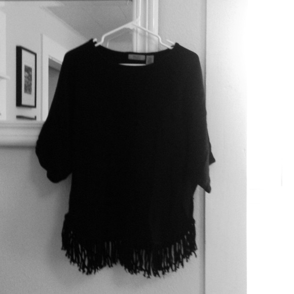 Valerie Steven's black poncho.