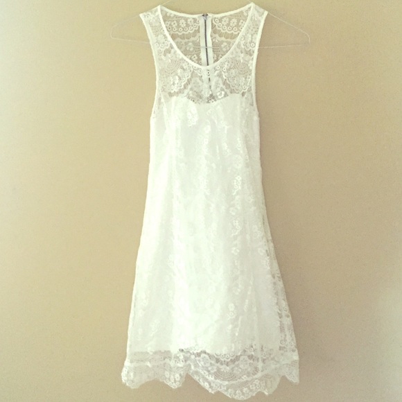 White lace-y body con dress with open back