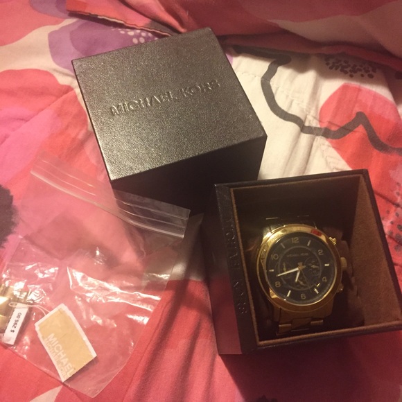 MK gold tone watch