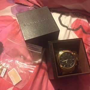 MK gold tone watch