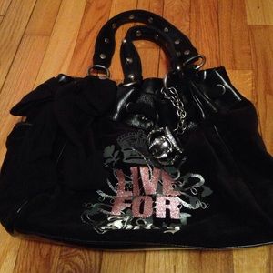 Medium sized black "live for juicy" hand bag.