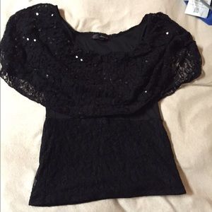 Black top, tight fitting.