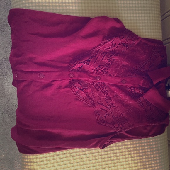 Flowing red lace shirt.