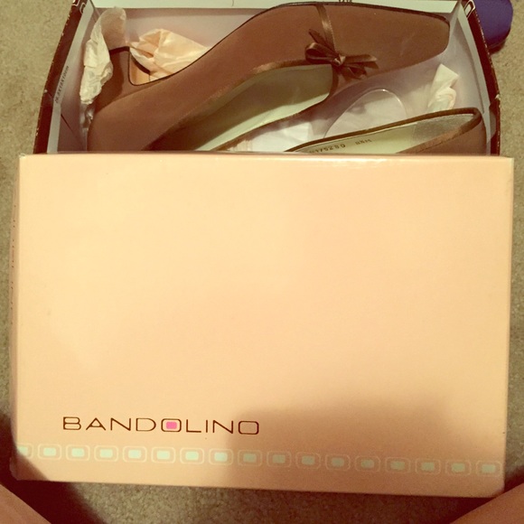 Brown shoes with a bow decal
