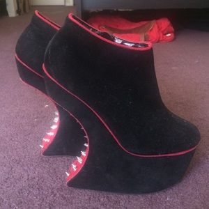 Black platform heel boots with spikes