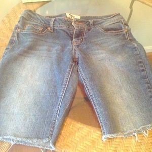 blue jean shorts down to just above the knees