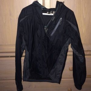 Black rain jacket. Folds into itself!