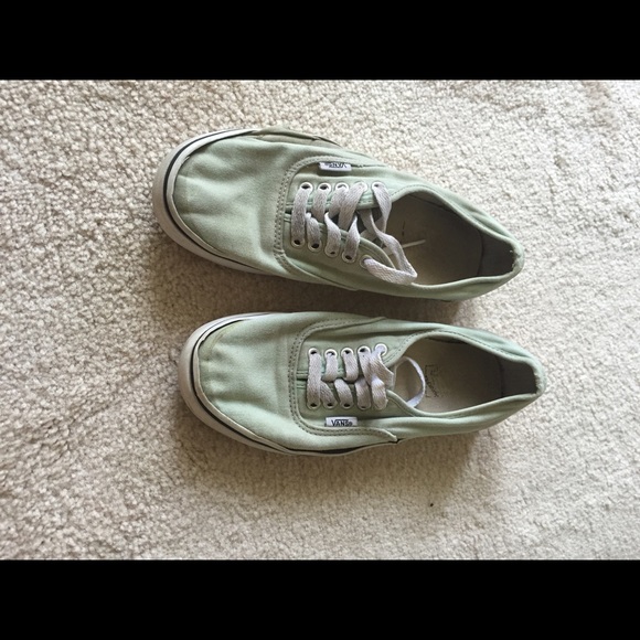 Very worn/used mint green Vans.