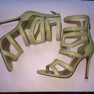 Schutz sandals with geometric cut outs.